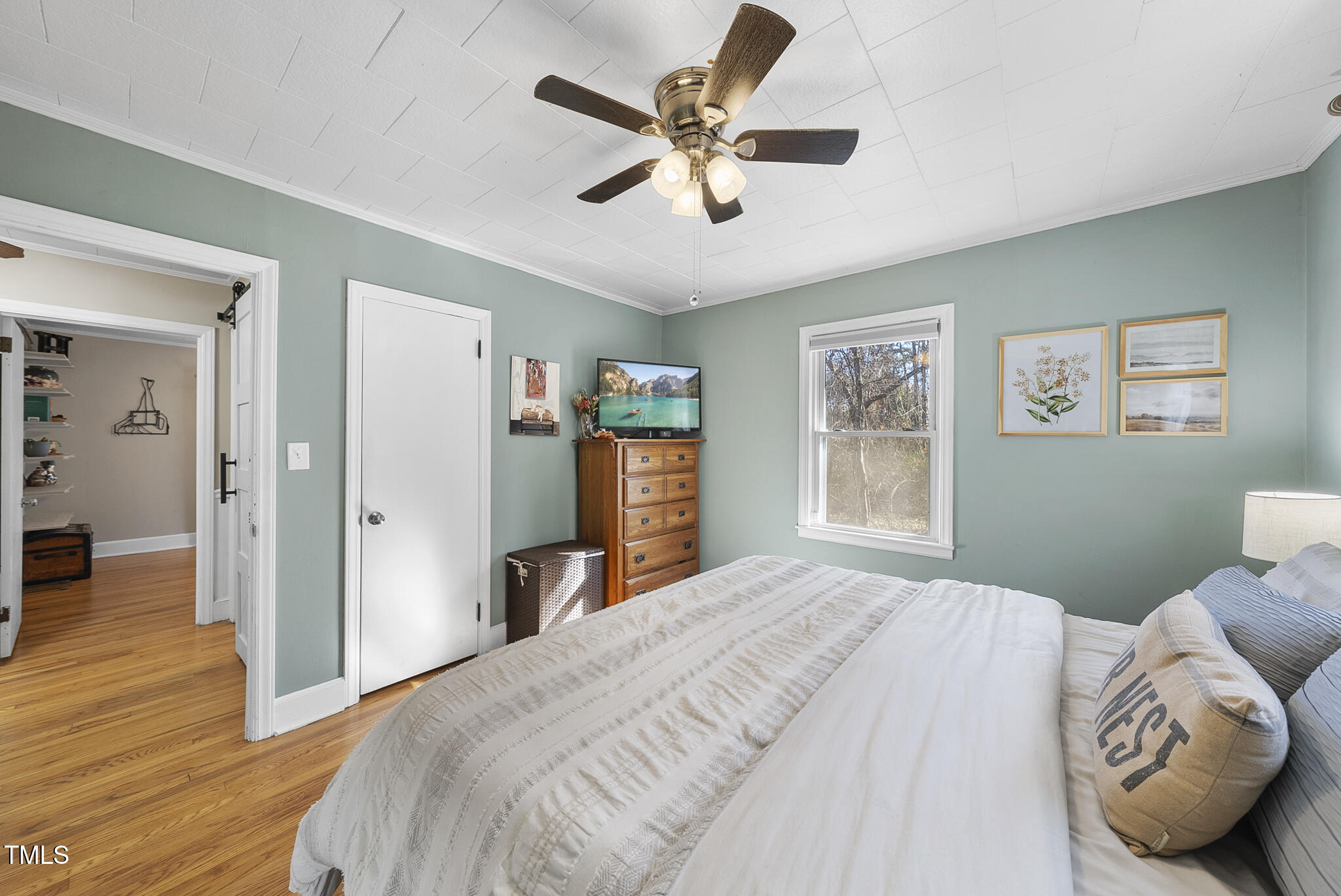 322 Robbins Road Durham, NC 27703 - Photo 11 of 48 a bedroom with a large bed and a window