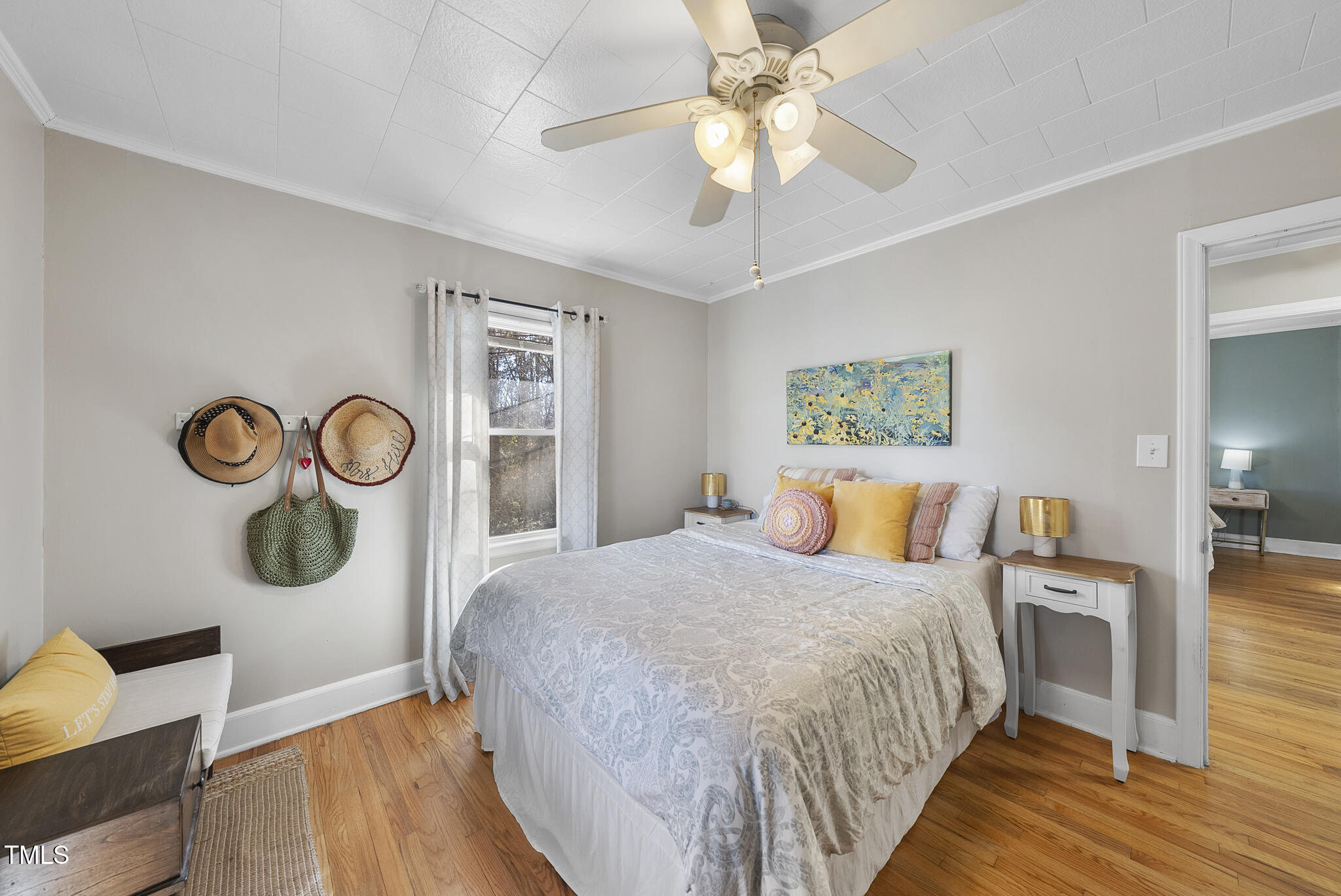 322 Robbins Road Durham, NC 27703 - Photo 12 of 48 a bedroom with a bed and a chandelier