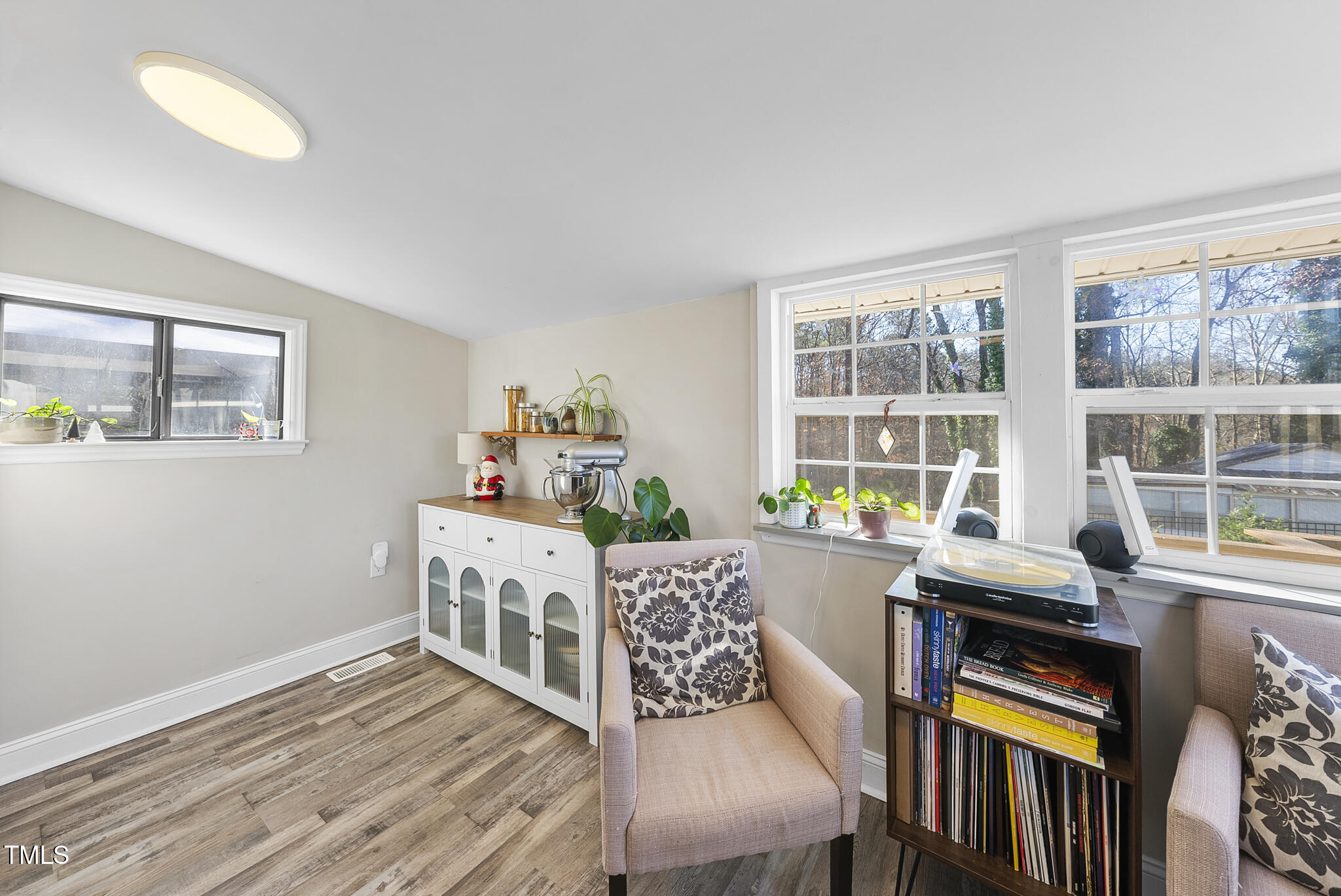 322 Robbins Road Durham, NC 27703 - Photo 27 of 48 a dining room with furniture a rug and wooden floor
