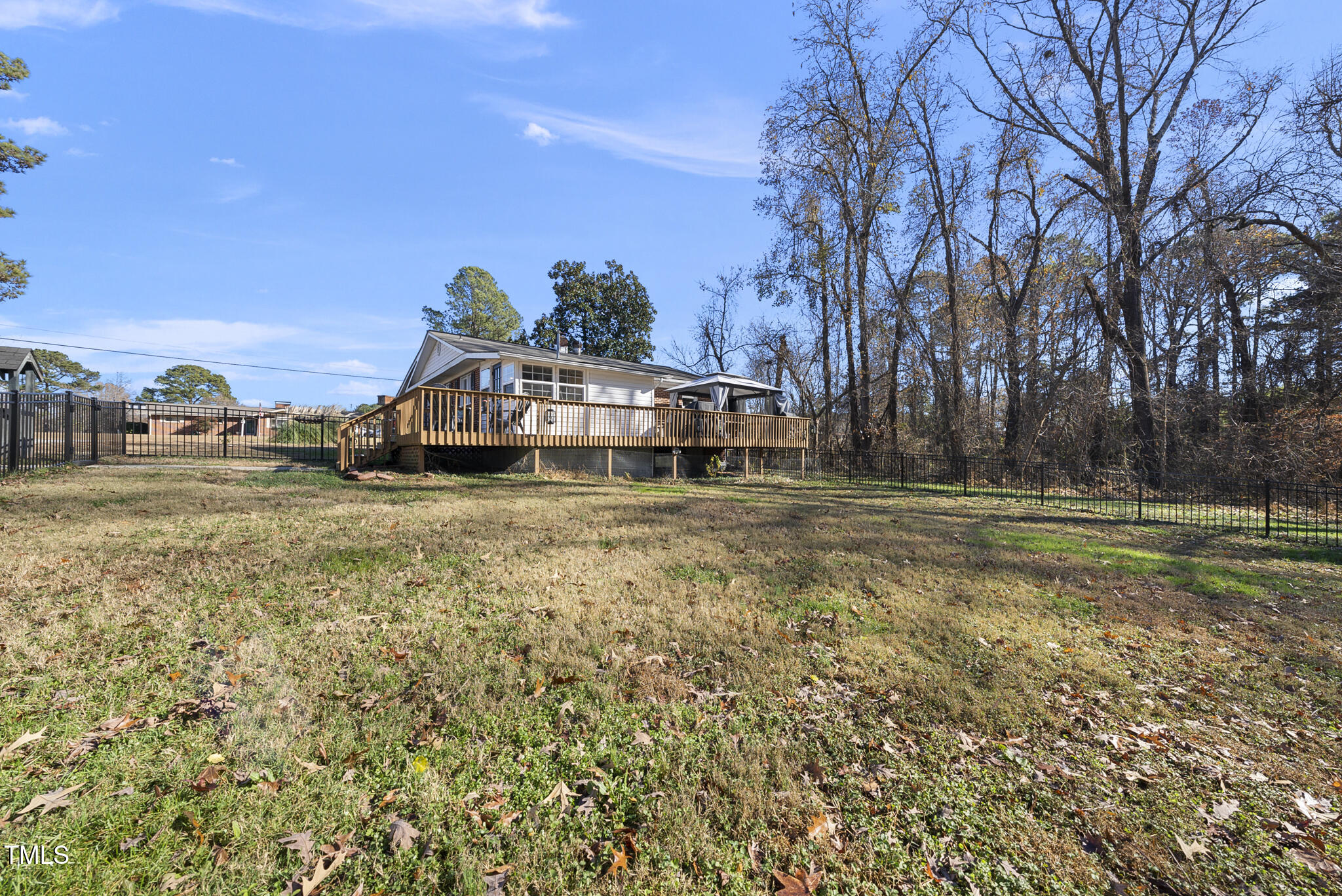 322 Robbins Road Durham, NC 27703 - Photo 36 of 48 a view of a house with a yard and sitting area