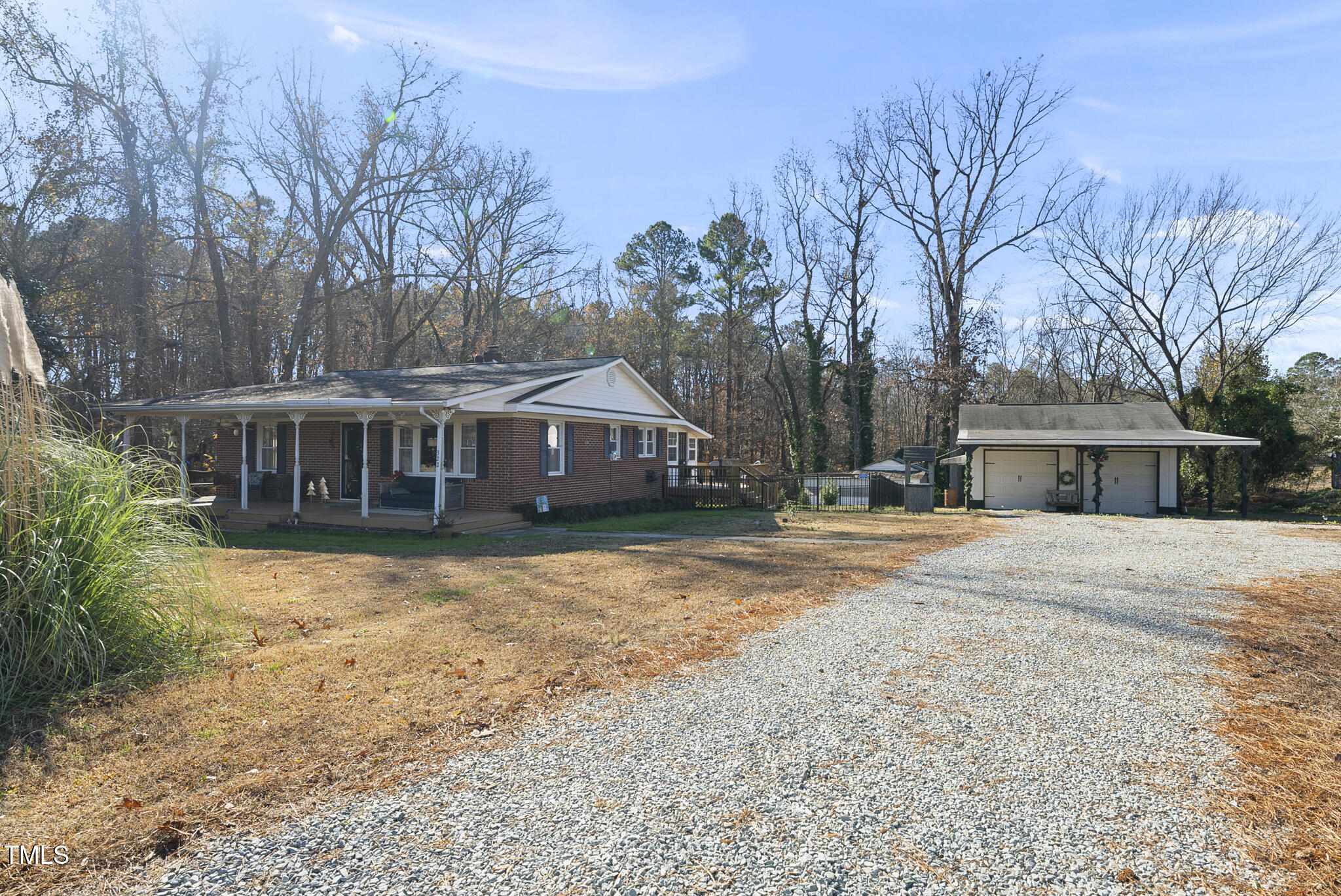 322 Robbins Road Durham, NC 27703 - Photo 40 of 48 a front view of a house with yard and trees