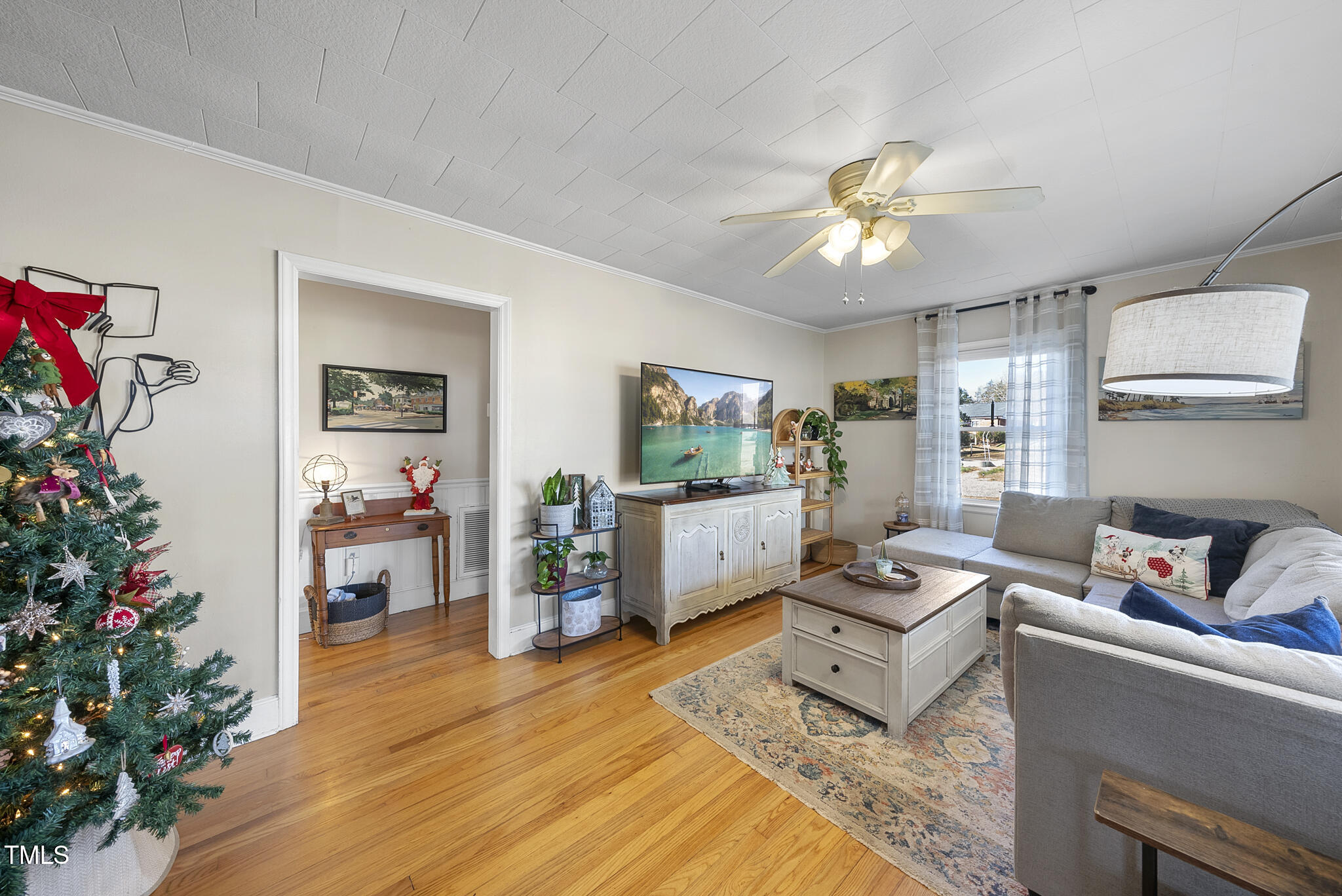 322 Robbins Road Durham, NC 27703 - Photo 6 of 48 a living room with furniture and a potted plant