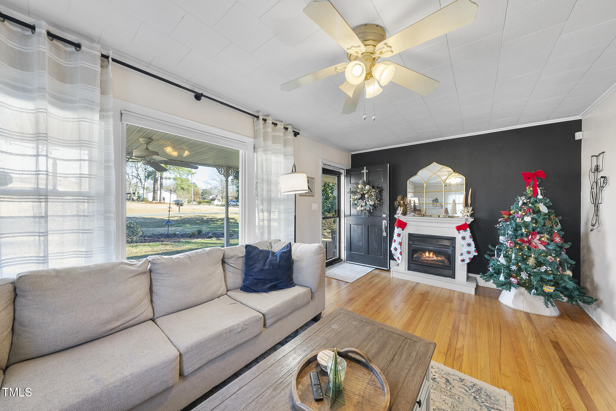 322 Robbins Road Durham, NC 27703 - Photo 8 of 48 a living room with furniture fireplace and a large window