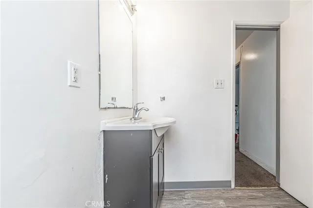 a bathroom with a sink and mirror