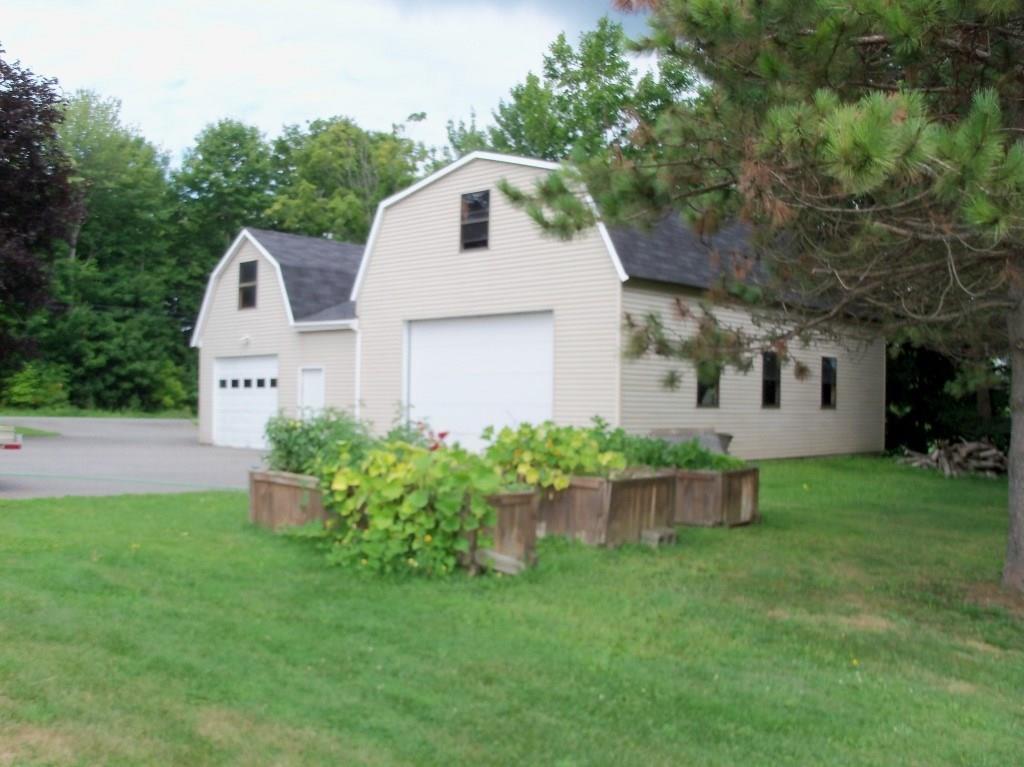 699 Hill Road Clinton, ME 04927 - Photo 20 of 28 Garage and raised garden beds.