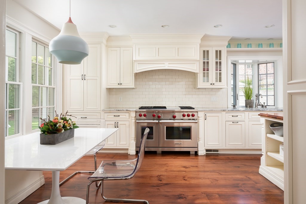 74 Colbert Road Newton, MA 02465 - Photo 8 of 21 a kitchen with a stove and a wooden floor