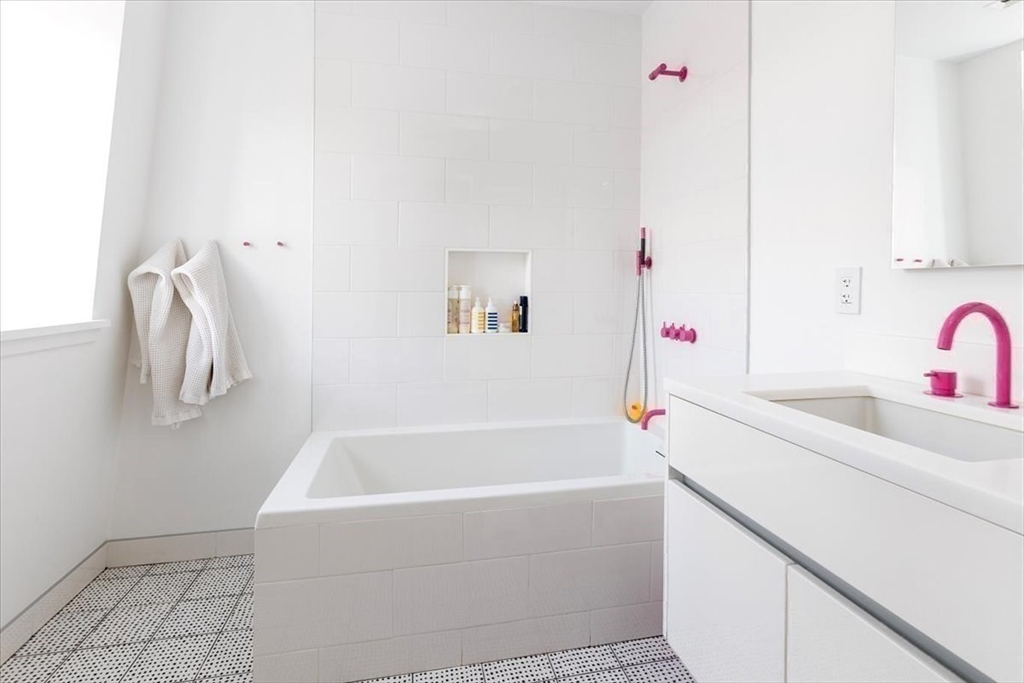 158 West Canton Street Boston, MA 02118 - Photo 15 of 25 a white bath tub sitting next to a white sink