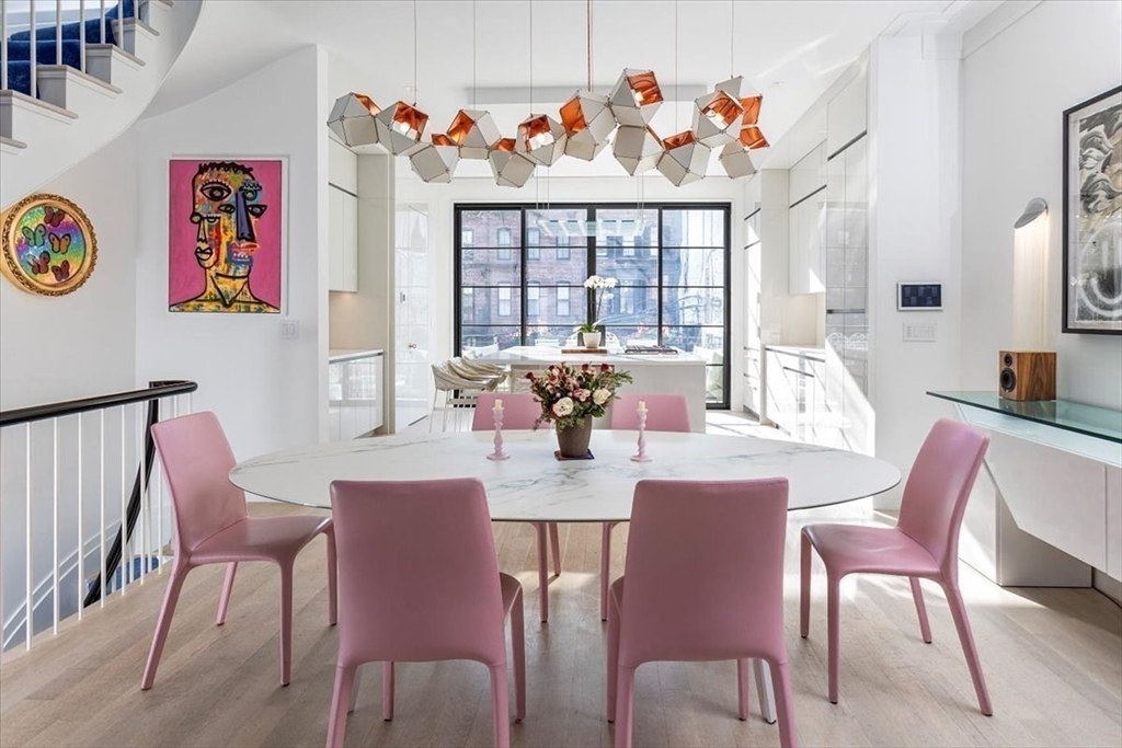 158 West Canton Street Boston, MA 02118 - Photo 2 of 25 a view of a dining room with furniture a chandelier and a large window
