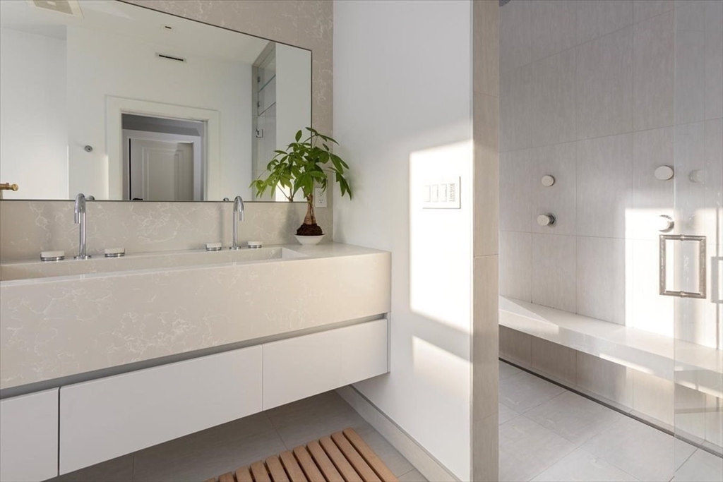 158 West Canton Street Boston, MA 02118 - Photo 10 of 25 a bathroom with a sink and a mirror