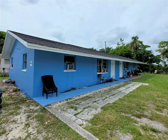 a front view of house with yard and seating