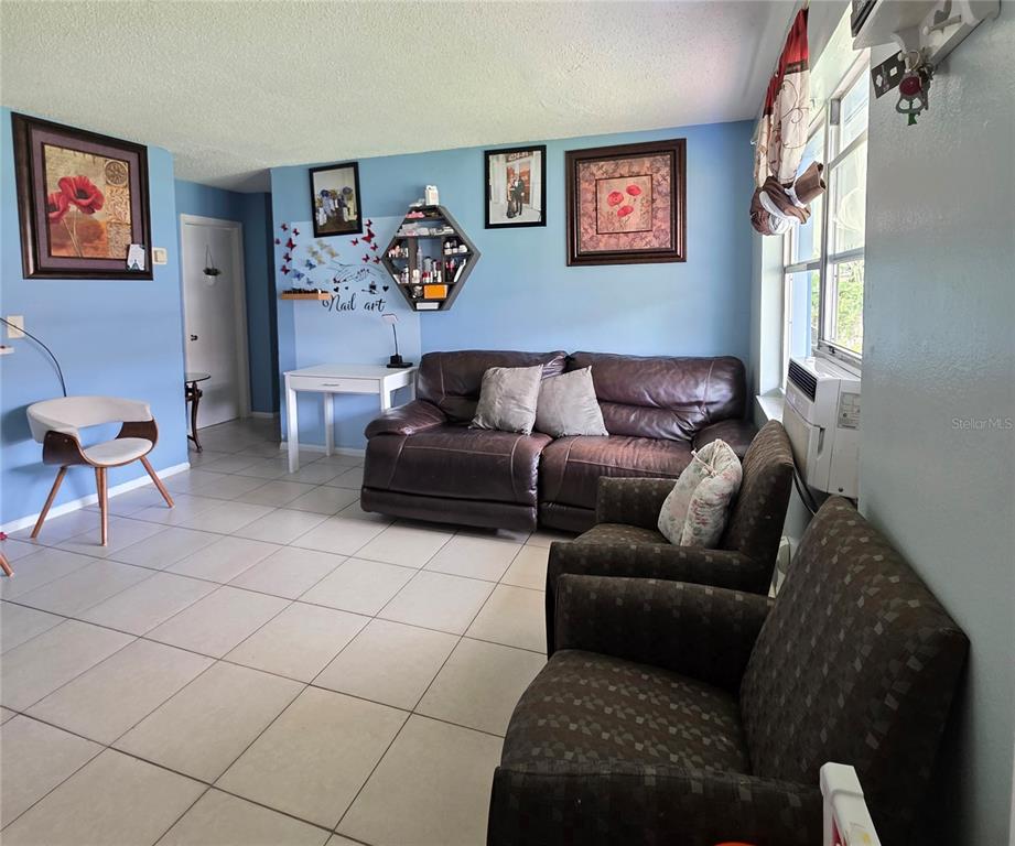 5462 Tenth Avenue Fort Myers, FL 33907 - Photo 5 of 20 a living room with furniture and a couch