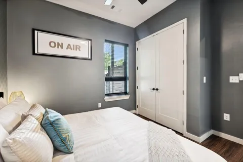 a bedroom with a bed and a window