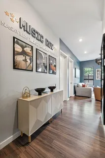 a hall with cabinets and wooden floor