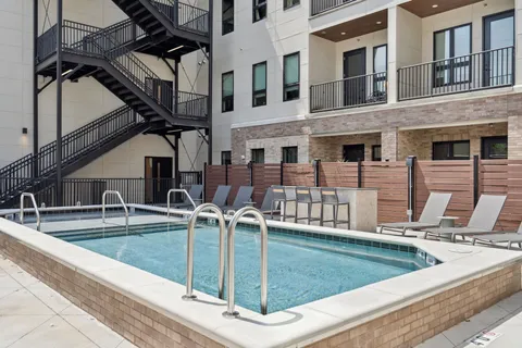 a view of backyard with sitting area