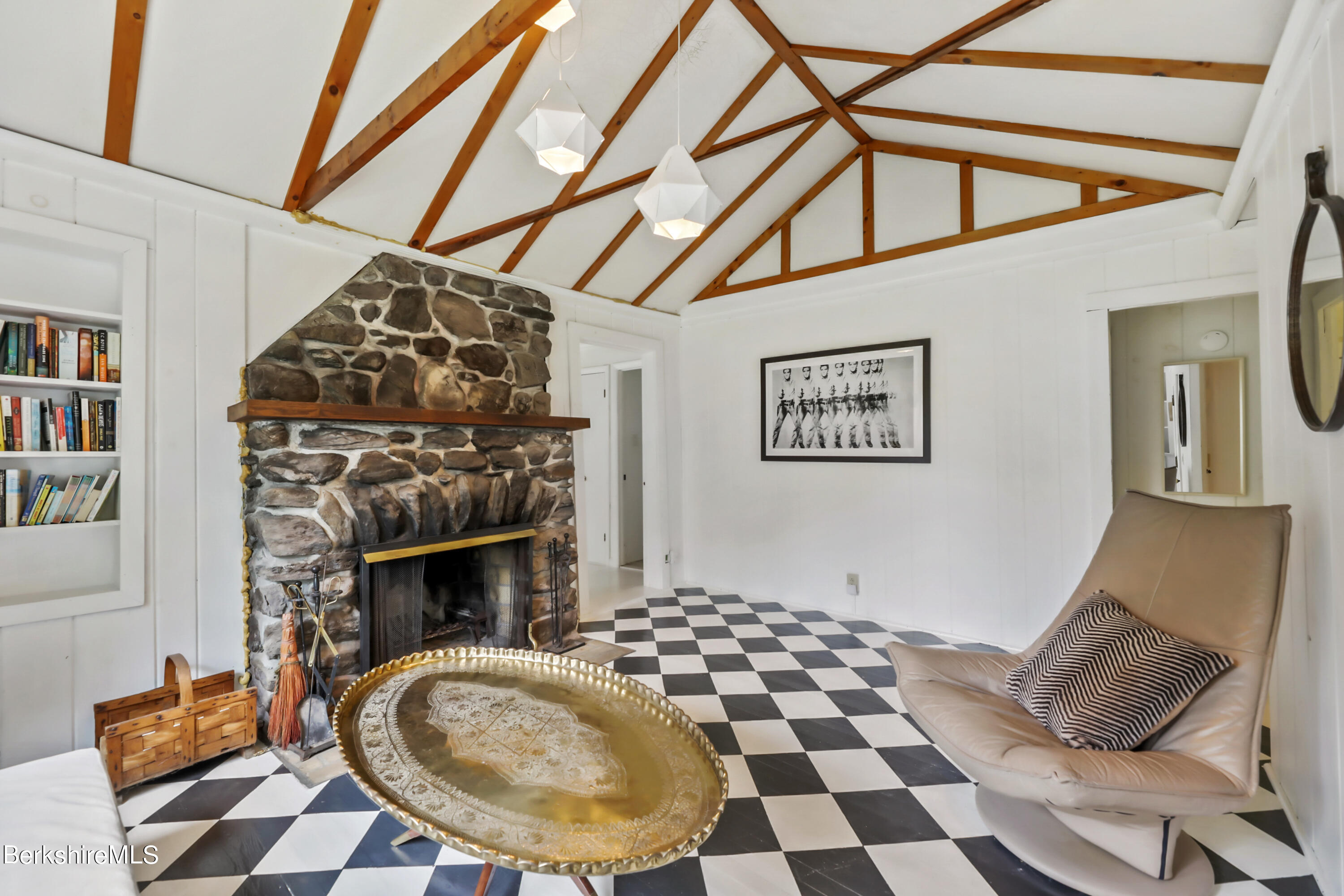 11 Mahkeenac Heights Road Stockbridge, MA 01262 - Photo 12 of 26 a living room with a couch and a fireplace