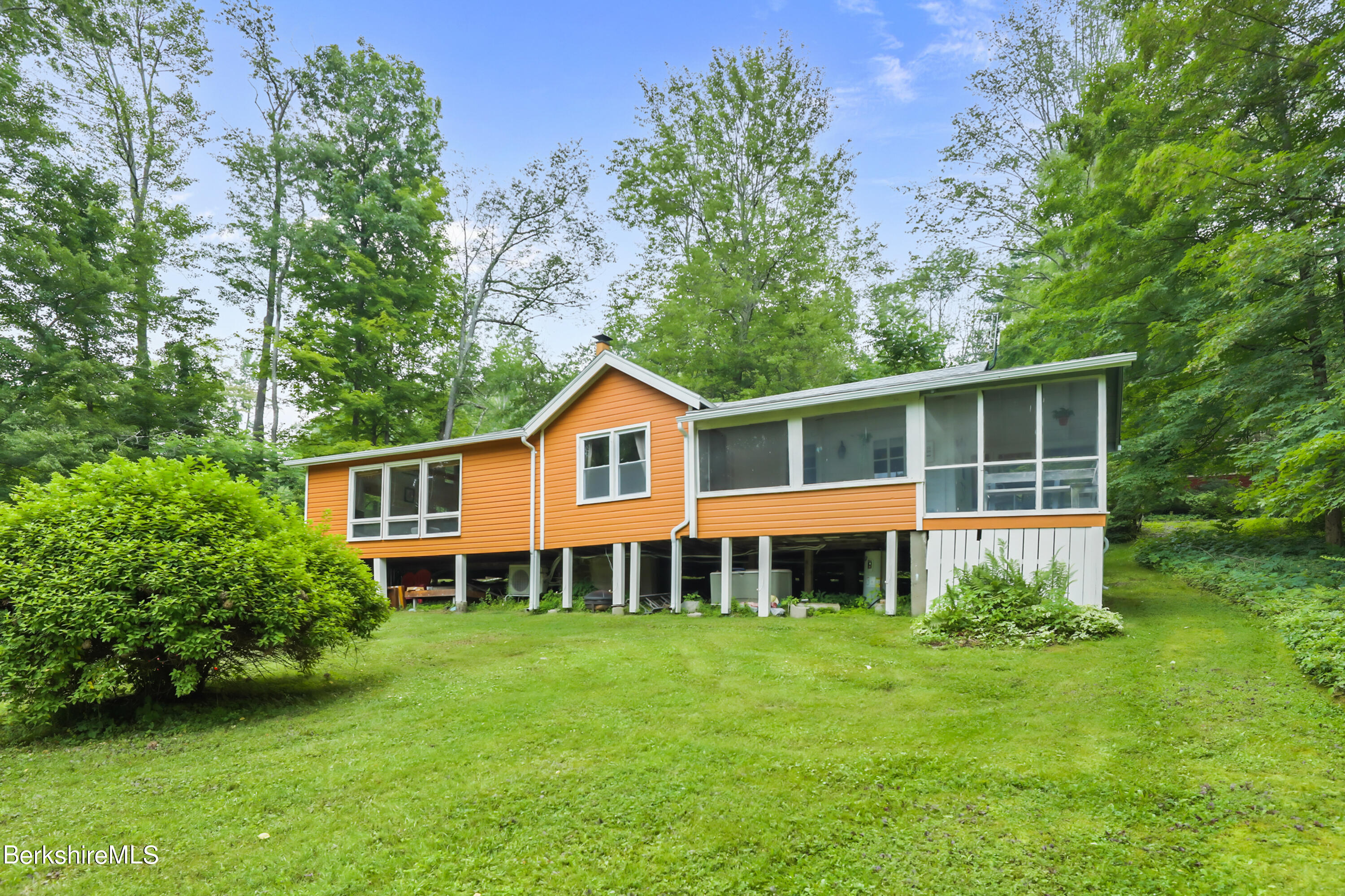 11 Mahkeenac Heights Road Stockbridge, MA 01262 - Photo 23 of 26 a view of a house with a yard and sitting area