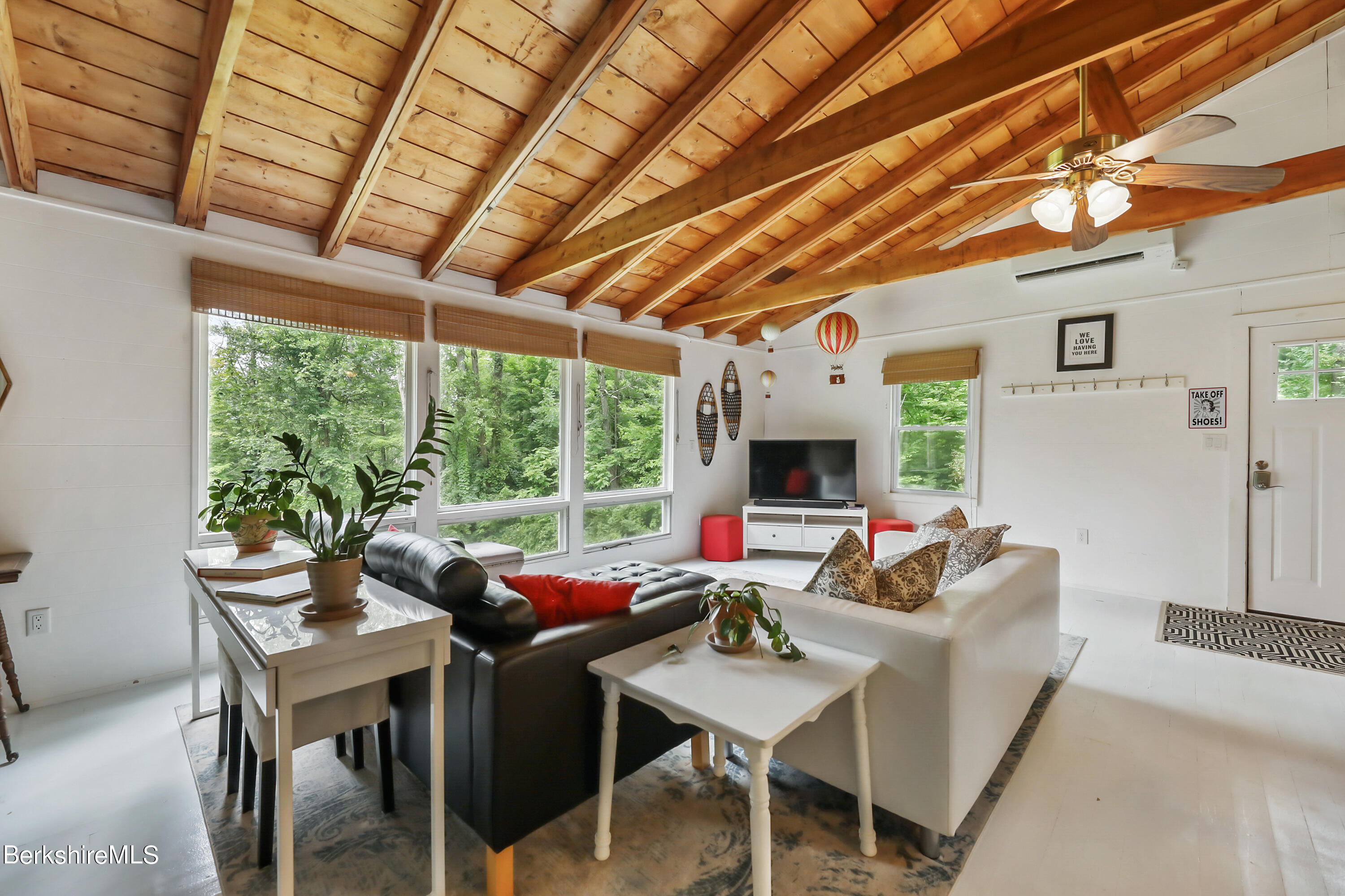 11 Mahkeenac Heights Road Stockbridge, MA 01262 - Photo 5 of 26 a living room with furniture a fireplace and a table