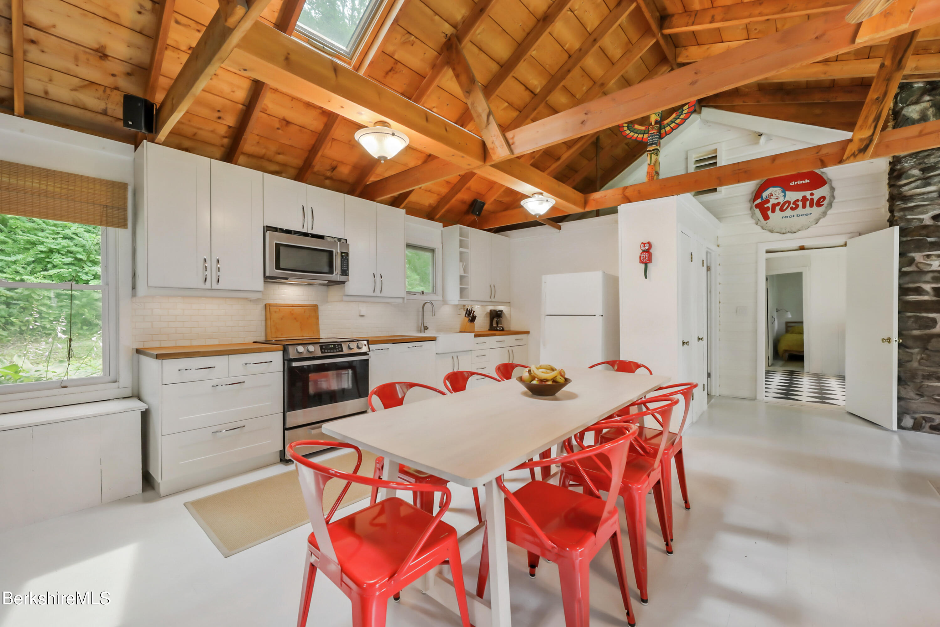 11 Mahkeenac Heights Road Stockbridge, MA 01262 - Photo 6 of 26 a kitchen with a stove a sink dishwasher and a refrigerator with wooden floor