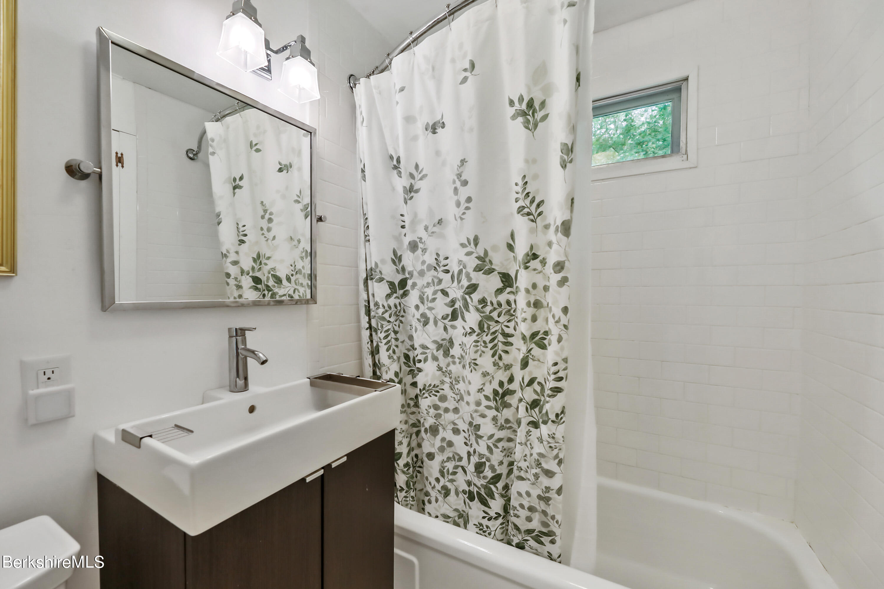 11 Mahkeenac Heights Road Stockbridge, MA 01262 - Photo 9 of 26 a bathroom with a sink a mirror a shower and a toilet
