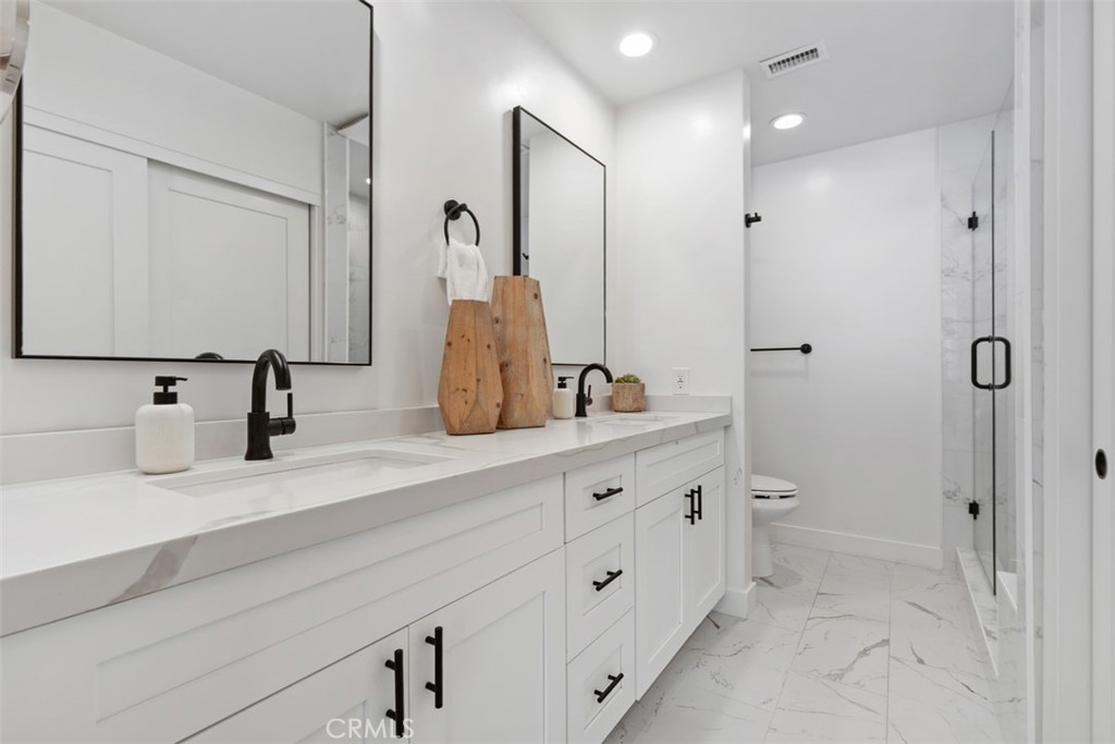 32772 Shipside Drive Dana Point, CA 92629 - Photo 14 of 56 a bathroom with double vanity sink and mirror