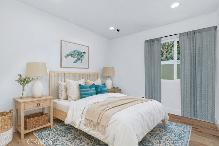 32772 Shipside Drive Dana Point, CA 92629 - Photo 17 of 56 a bedroom with a bed and a painting on the wall