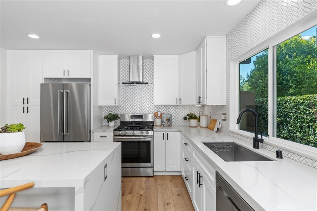 32772 Shipside Drive Dana Point, CA 92629 - Photo 23 of 56 a kitchen with a stove a sink a refrigerator and a window
