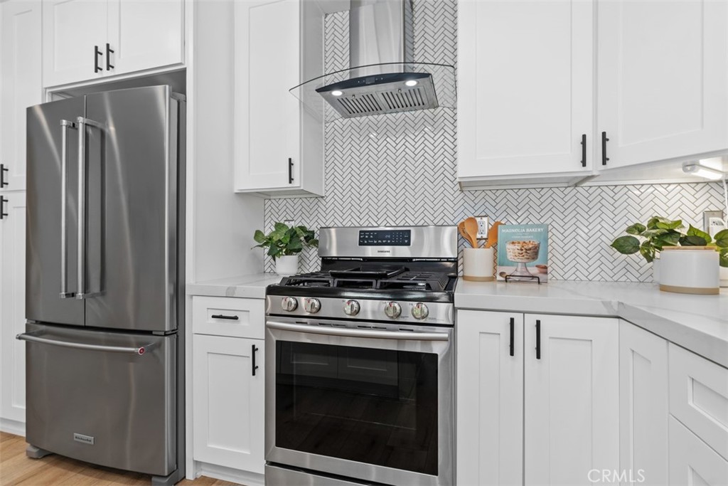 32772 Shipside Drive Dana Point, CA 92629 - Photo 25 of 56 a kitchen with stainless steel appliances white cabinets and a stove