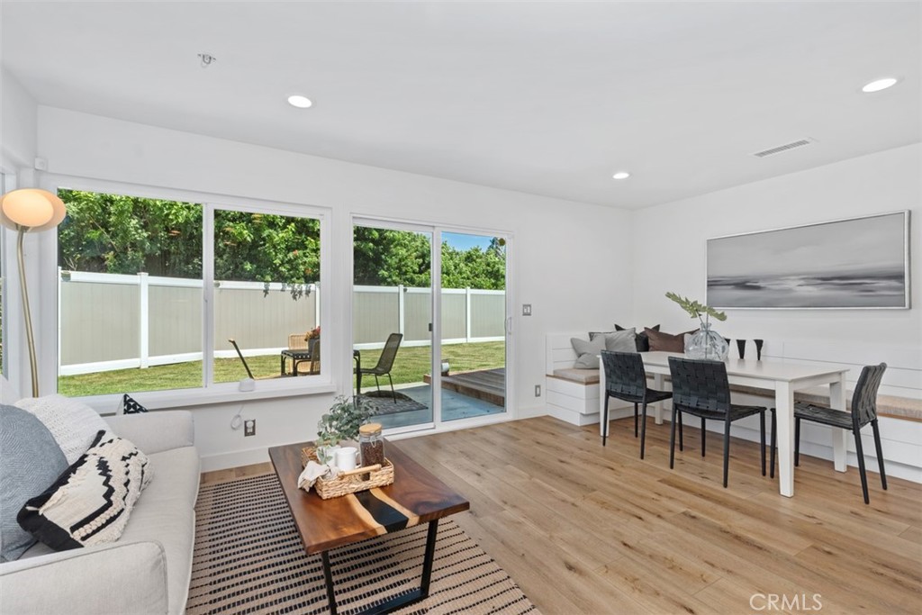 32772 Shipside Drive Dana Point, CA 92629 - Photo 26 of 56 a living room with furniture and a dining table with wooden floor