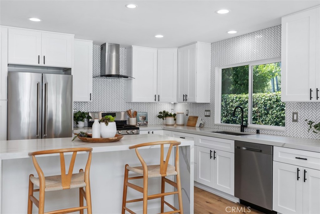 32772 Shipside Drive Dana Point, CA 92629 - Photo 6 of 56 a kitchen with a sink a window and stainless steel appliances