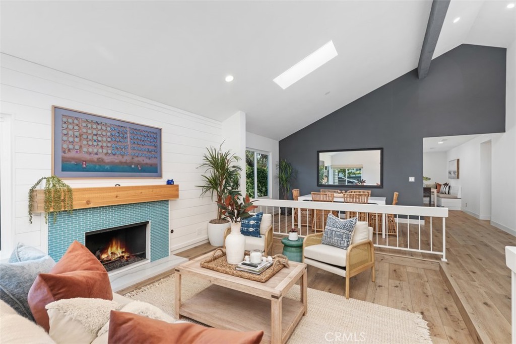 32772 Shipside Drive Dana Point, CA 92629 - Photo 7 of 56 a living room with furniture a fireplace and a table