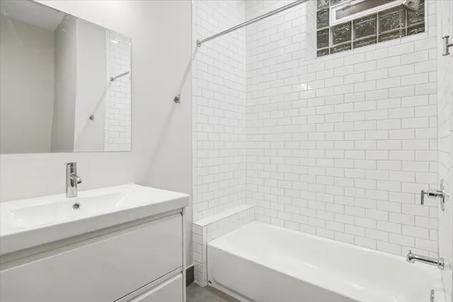 a bathroom with a sink a bathtub and a shower