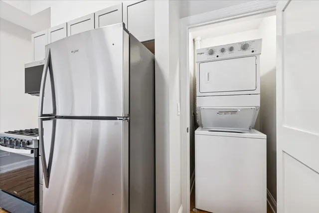 a white refrigerator freezer and a stove sitting inside of a kitchen