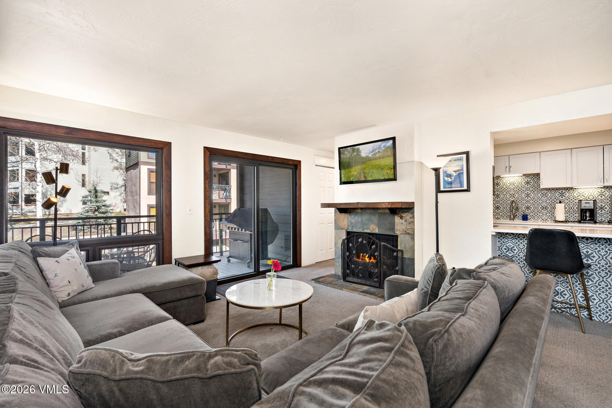963 Lions Ridge Loop, Unit 502 Vail, CO 81657 - Photo 1 of 30 a living room with furniture fireplace and window