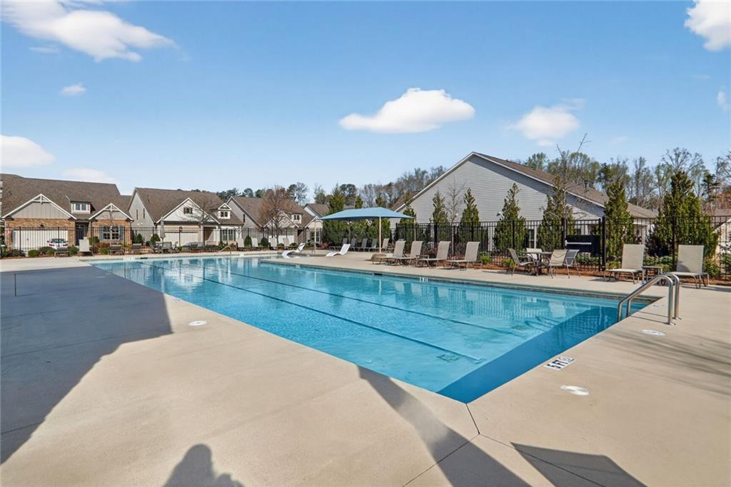 3321 Orwell Way, Unit 3402 Cumming, GA 30041 - Photo 28 of 30 a view of a swimming pool with an outdoor seating