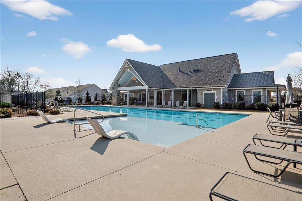 3321 Orwell Way, Unit 3402 Cumming, GA 30041 - Photo 29 of 30 a view of a house with swimming pool and sitting area