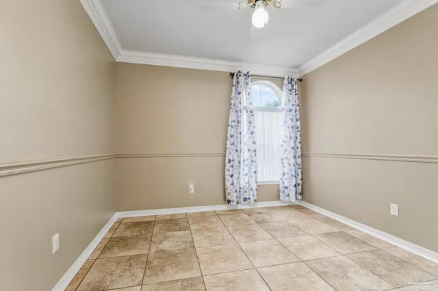 a view of an empty room with windows