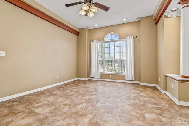 an empty room with windows and closet