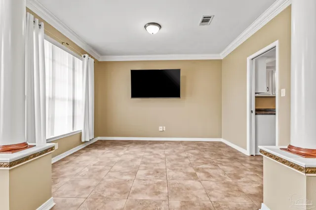 a kitchen with granite countertop a sink a stove and cabinets
