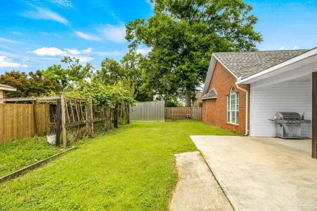 a house view with swimming pool and sitting space