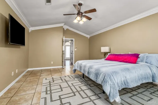 a bedroom with a bed and a ceiling fan