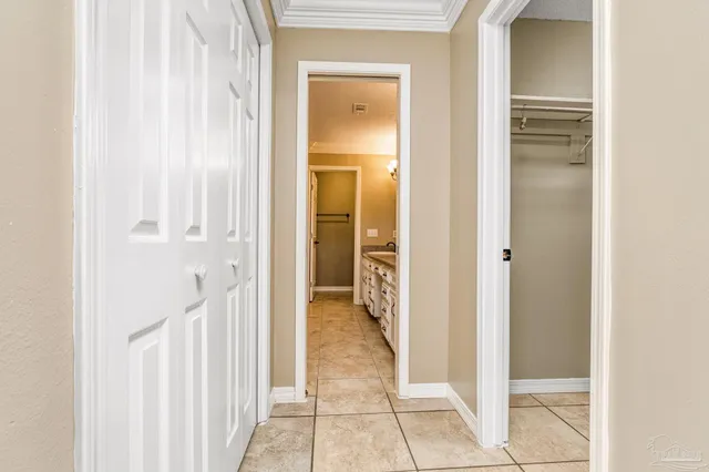 a view of a bathroom from a corridor