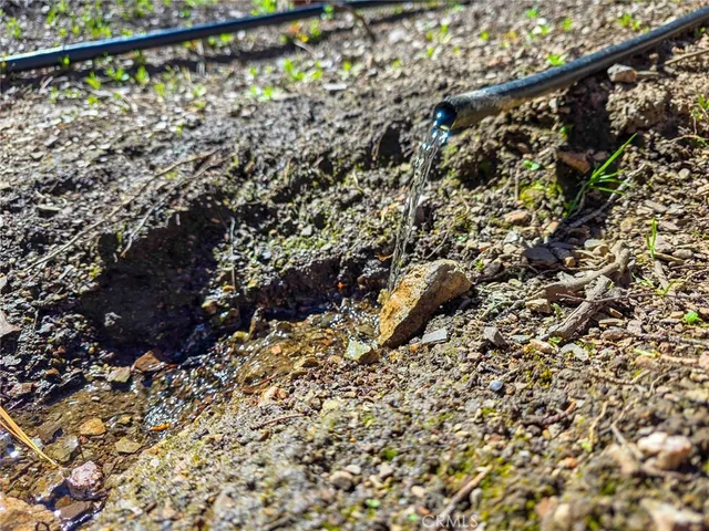 a fire hydrant in the middle of a field