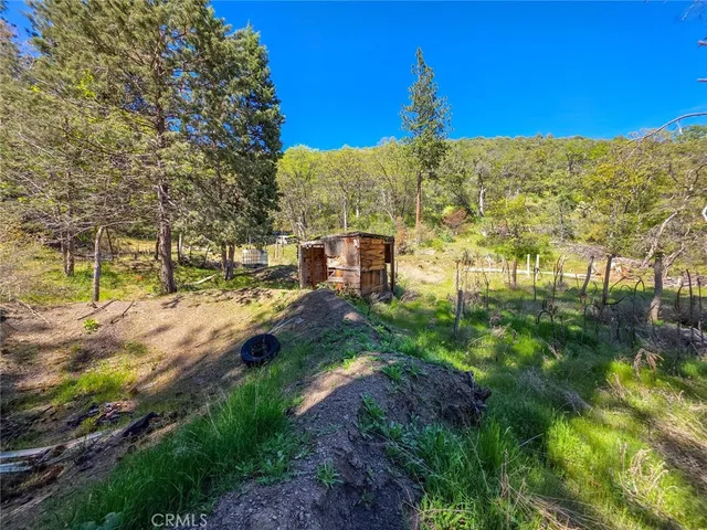 a view of a house with backyard porch and sitting area