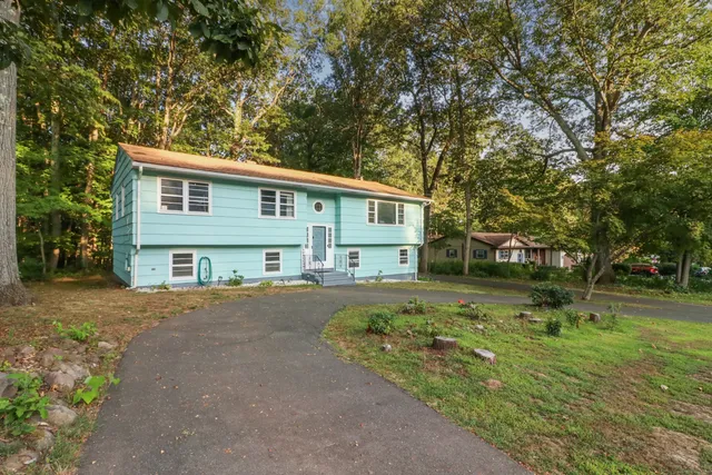 front view of a house with a yard