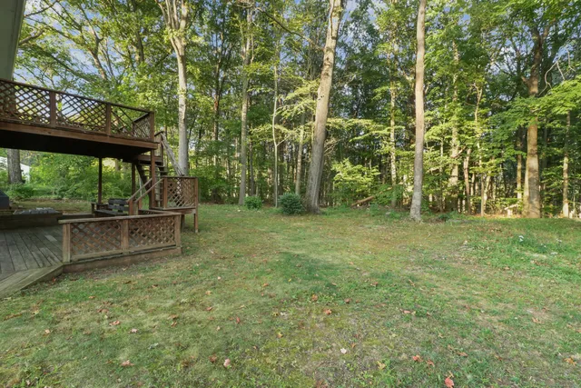 a view of outdoor space with deck and backyard