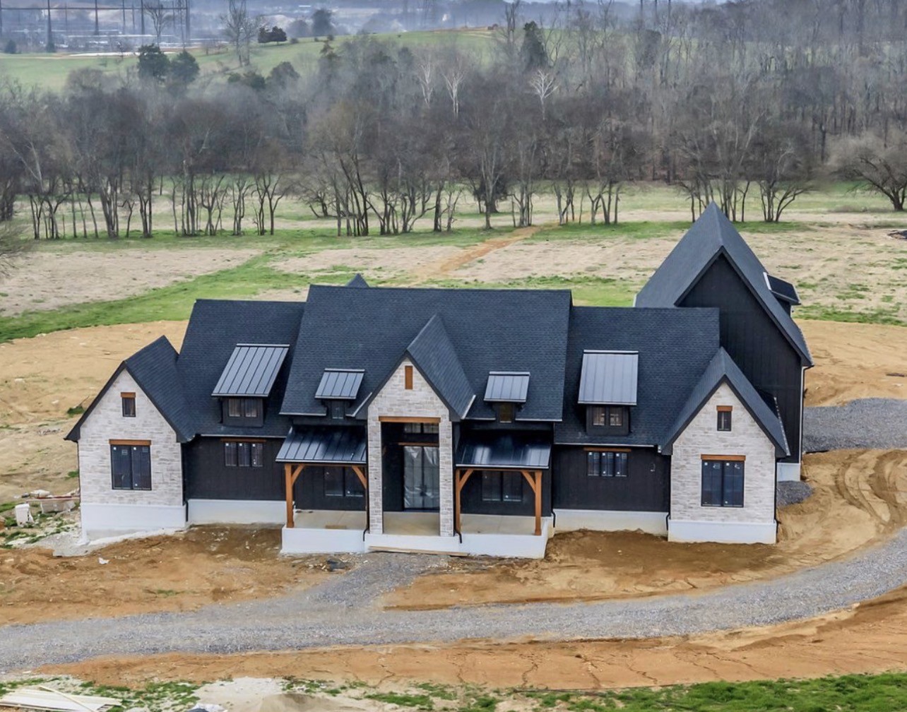 a view of house with yard