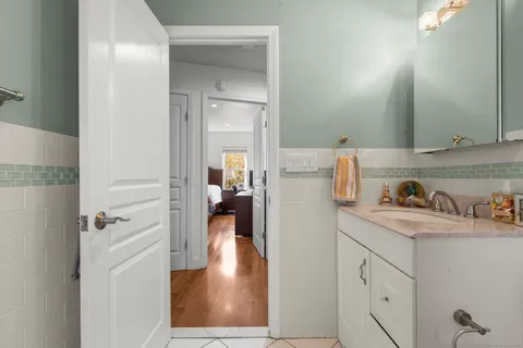 a bathroom with a sink and mirror