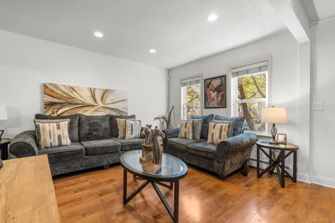 a living room with furniture and a rug