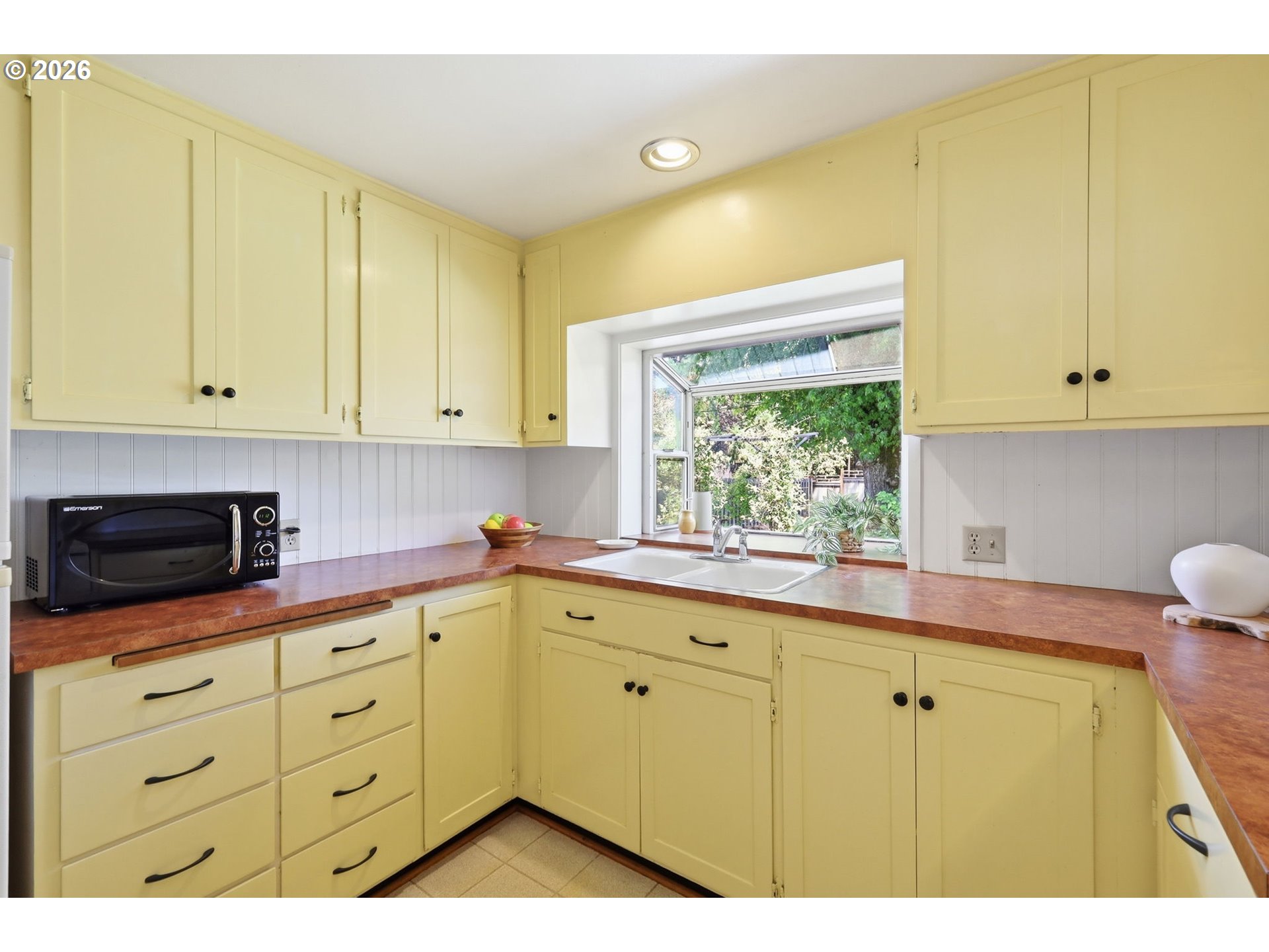 3025 Harris Street Eugene, OR 97405 - Photo 18 of 44 a kitchen with a sink and cabinets