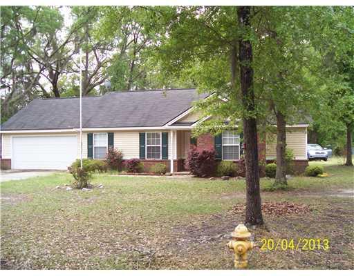 439 Archer Road, Unit 20 Guyton, GA 31312 - Photo 1 of 1 front view of a house with a yard